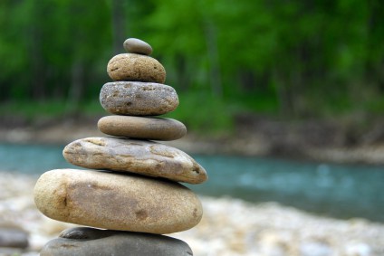 stacked-stones-by-river